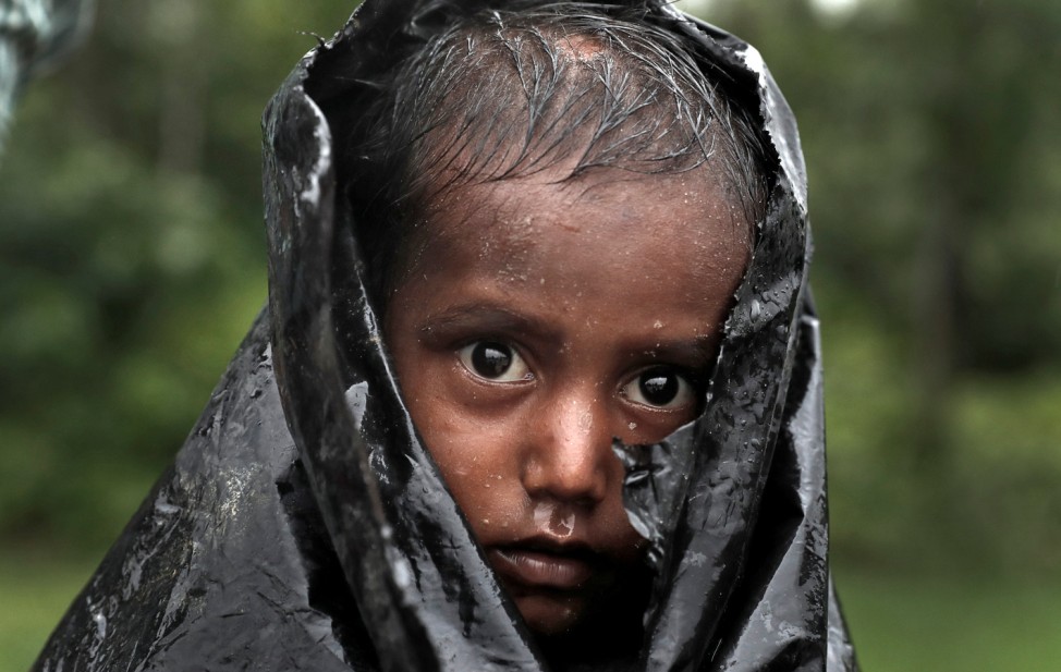 A Rohingya refugee boy waits for aid in Cox's Bazar, Bangladesh