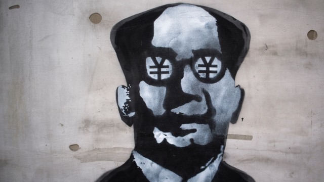 Konjunktur: Hauptsache Geld? China macht immer mehr Schulden. Das Graffiti zeigt den früheren Staatschef Mao Zedong mit Währungszeichen.