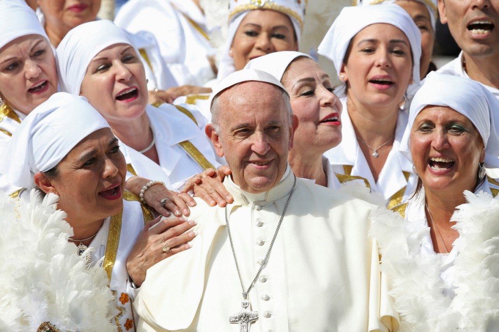 Pope Francis poses with a group of faithfuls from Mexico during the Wednesday general audience in Saint Peter's Square at the Vatican