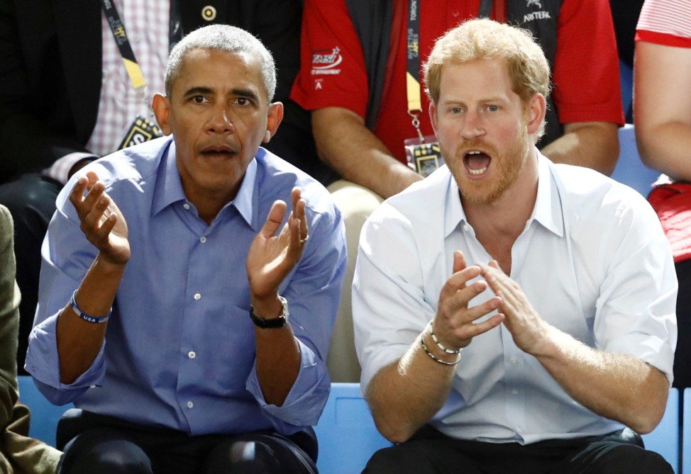 Britain's Prince Harry and former U.S. President Obama watch a wheelchair basketball event during the Invictus Games in Toronto
