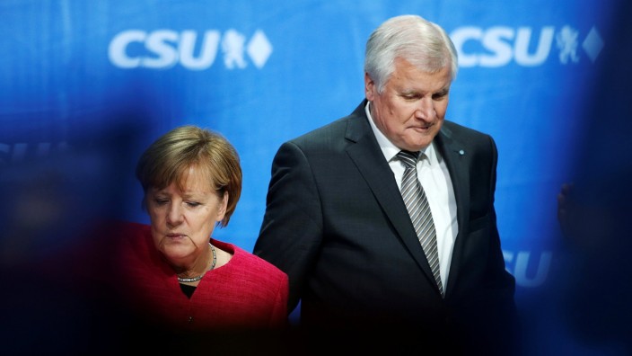 German Chancellor Merkel, top candidate of CDU for upcoming general elections and Seehofer head of CSU leave final election rally in Munich