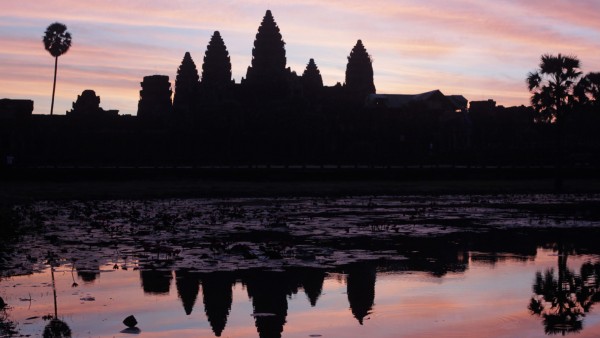 Cambodia's famous Angkor Wat temple is reflected in a pond during sunrise in Siem Reap; WIR