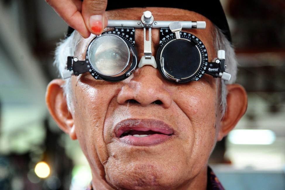 A man has his eyes checked at a government pavillion during a World Sight Day event in Pontianak