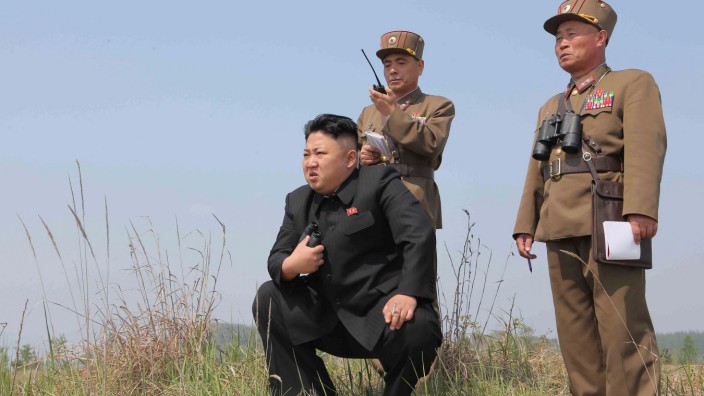 FILE PHOTO: North Korean leader Kim Jong Un guides the multiple-rocket launching drill of women's sub-units under KPA Unit 851