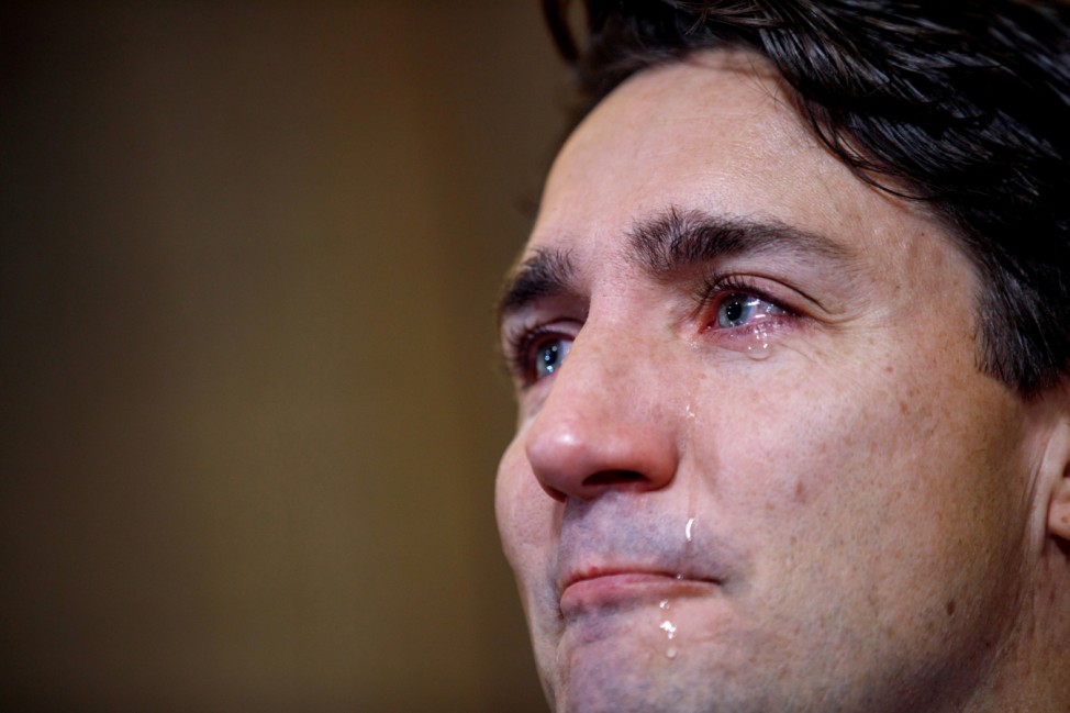 Trudeau sheds tears as he speaks with media about the death of Tragically Hip singer Gord Downie in Ottawa