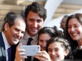 Children take a 'selfie' with Canada's PM Trudeau and Toronto Waterfront CEO Fleissig, during a press conference where Alphabet Inc, the owner of Google, announced the project 'Sidewalk Toronto' in Toronto