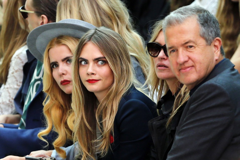 Singer Faith, models Cara Delevingne and Kate Moss, and photographer Testino watch the presentation of the Burberry Prorsum Spring/Summer 2015 collection during London Fashion Week