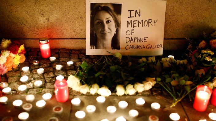 Candles burn to commemorate the killed investigative journalist Daphne Caruana Galizia in Berlin