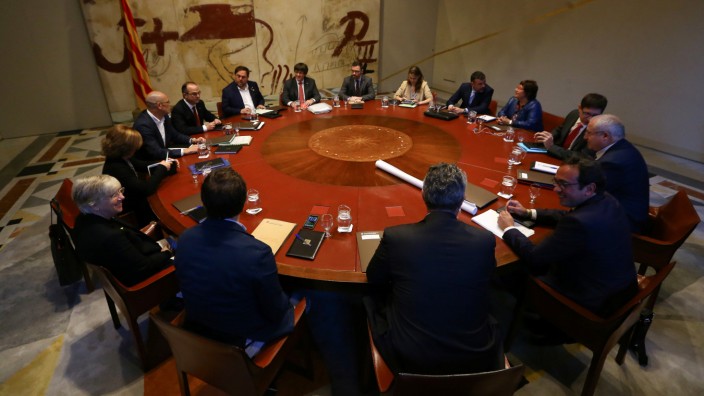 Catalan President Puigdemont presides over a cabinet meeting at Generalitat Palace in Barcelona