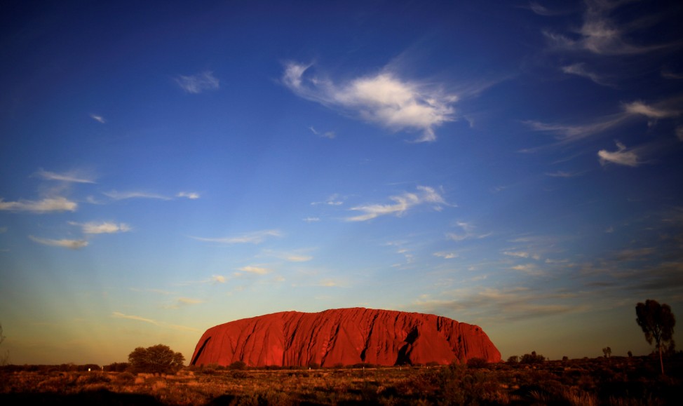 FILE PHOTO: Uluru is lit by the setting sun in the Northern Territory in central Australia