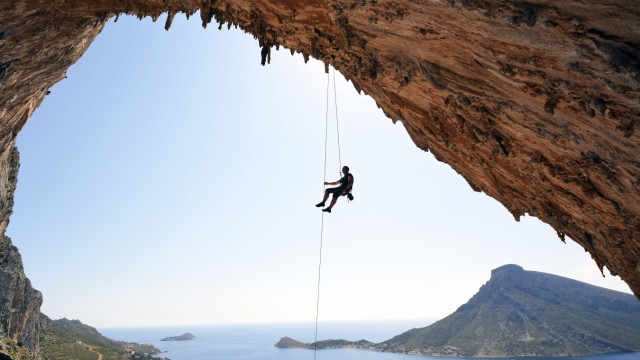 Greece Kalymnos climber abseiling in grotto model released Symbolfoto PUBLICATIONxINxGERxSUIxAUTxH