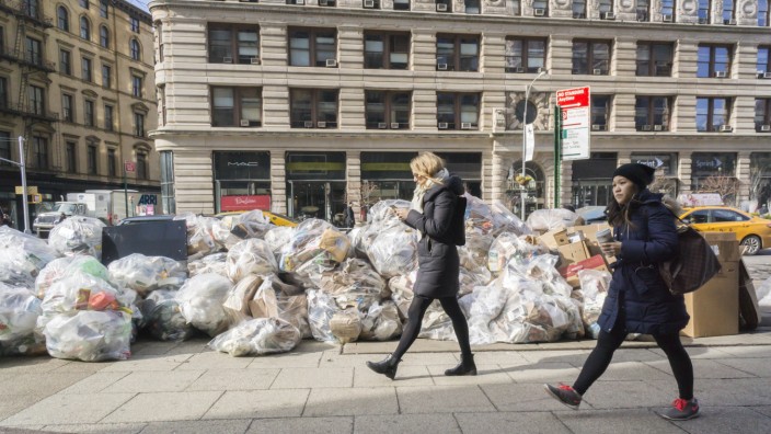 Trash accumulates and awaits pick up in New York Bags of trash await pick up in the Flatiron neighbo