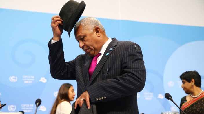 Fiji PM and COP23 President Bainimarama takes off his hat at the final session of the U.N. Climate Change Conference 2017 in Bonn