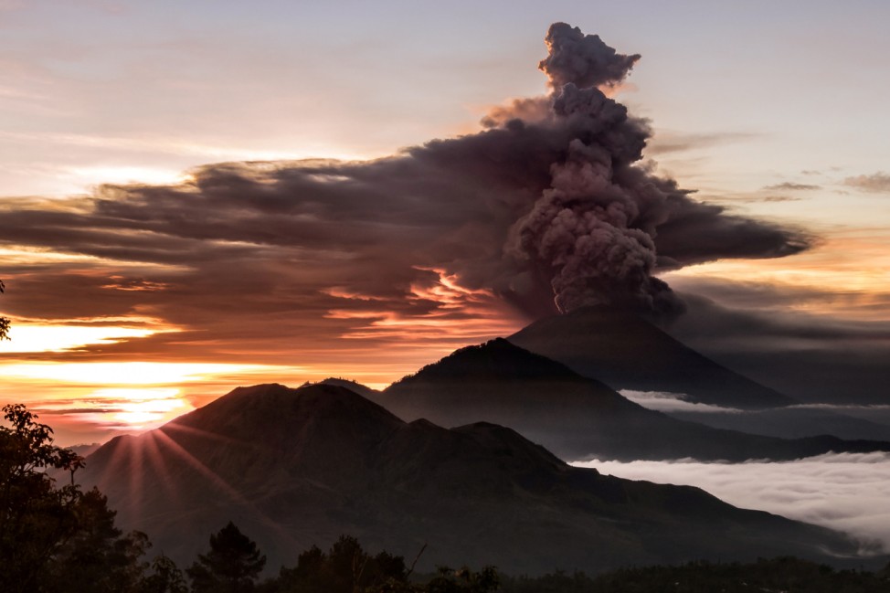 Mount Agung volcano is seen spewing smoke and ash in Bali, Indonesia