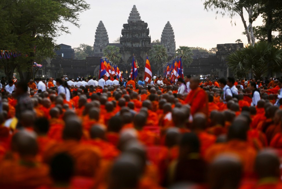 Buddhist monks attend a ceremony at the Angkor Wat temple to pray for peace and stability in Cambodia, in Siem Reap