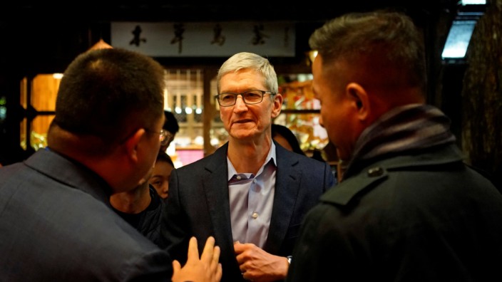 Apple CEO Tim Cook arrives before the fourth World Internet Conference in Wuzhen, Zhejiang province