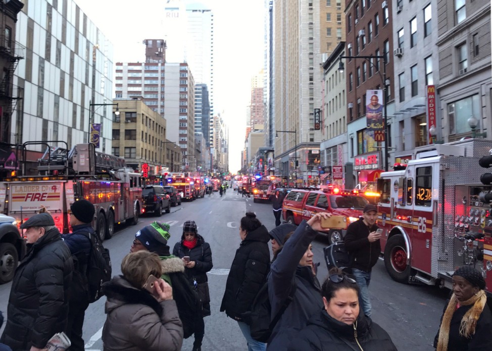Police and fire crews block off the streets near the New York Port Authority in New York City after reports of an explosion