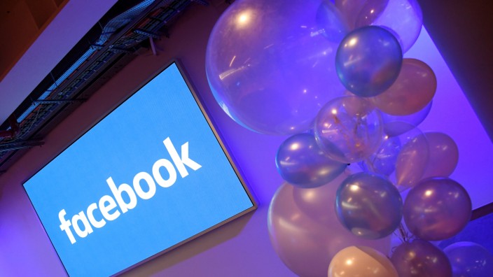 FILE PHOTO: Balloons are seen in front of a logo at Facebook's headquarters in London