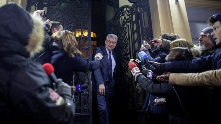 Romania's Prime Minister Tudose leaves a meeting of the Social Democrat Party in Bucharest