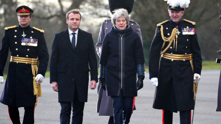 France's President Emmanuel Macron and Britain's Prime Minister Theresa May arrive at Sandhurst Military Academy in Sandhurst