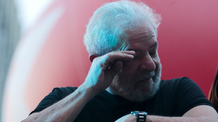 Brazil's former President Luis Inacio Lula da Silva reacts after his trial in Sao Paulo