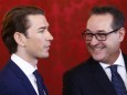 Head of the Freedom Party  Strache and head of the People's Party Kurz react during the swearing-in ceremony of the new government in Vienna