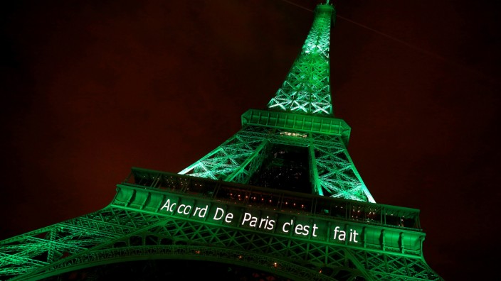 The Eiffel tower is illuminated in green with the words 'Paris Agreement is Done', to celebrate the Paris U.N. COP21 Climate Change agreement in Paris