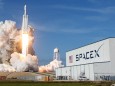 A SpaceX Falcon Heavy rocket lifts off from the Kennedy Space Center in Cape Canaveral