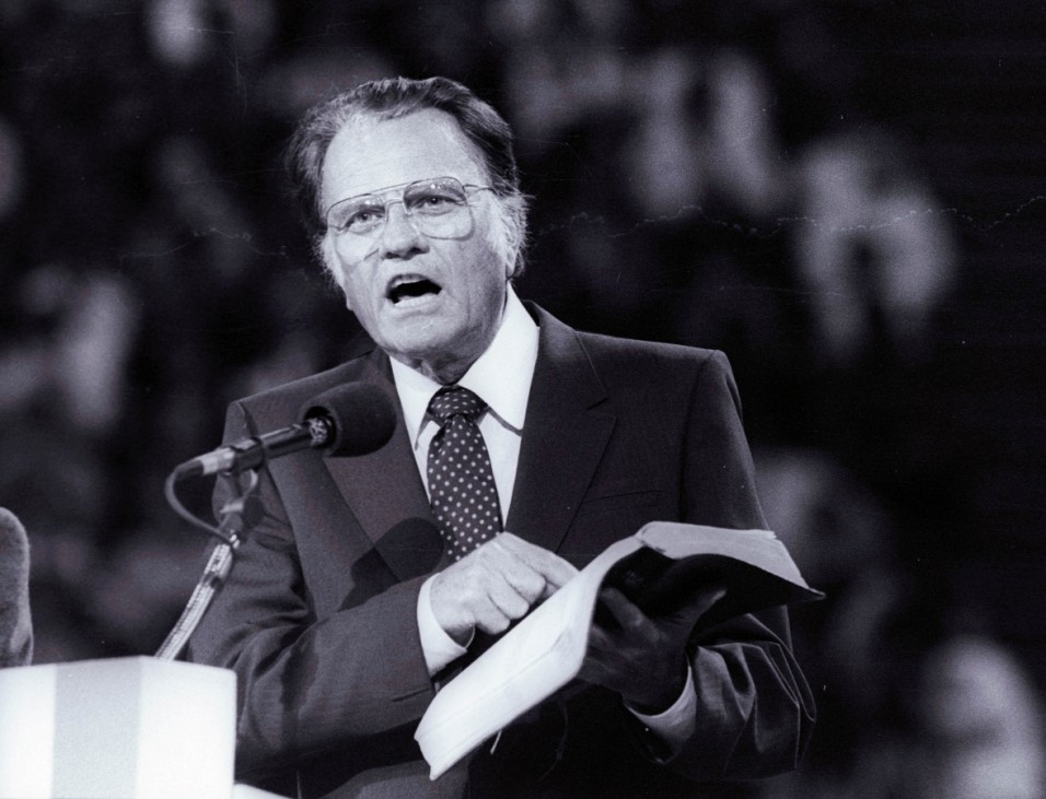 FILE PHOTO: U.S. evangelist Graham preaches the Gospel to thousands of believers during tonight's meeting at Bercy's Stadium in Paris as part of a worldwide crusade