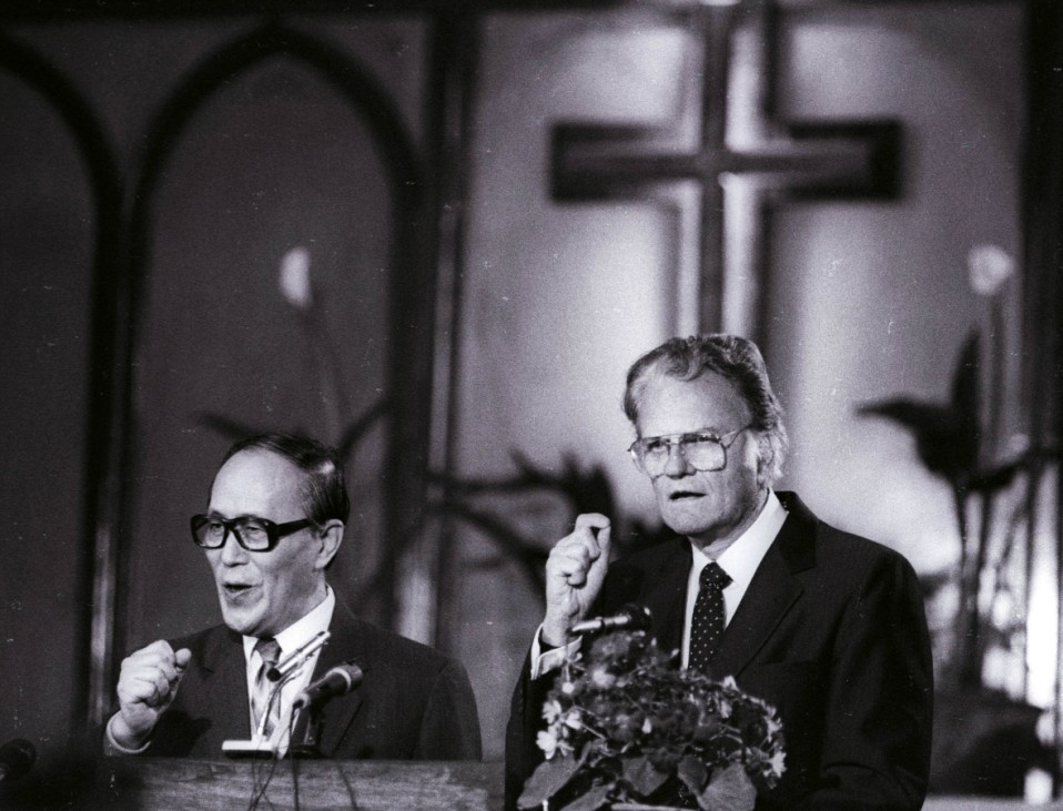 FILE PHOTO:  American evangelist Billy Graham preaches to the congregation at Chongwenmen church in China