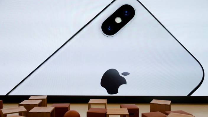 FILE PHOTO: An iPhone X is seen on a large video screen in the new Apple Visitor Center in Cupertino