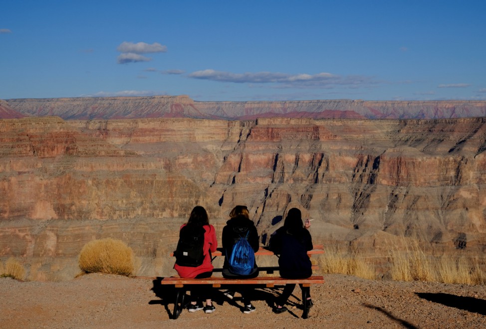 Tourists look at the view from Guano Point on the west rim of the Grand Canyon on the Hualapai Indian Reservation