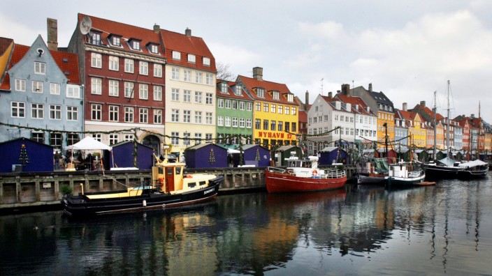 Boats are seen anchored at the 17th century Nyhavn district, home to many shops and restaurants in Copenhagen