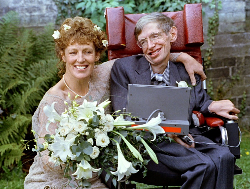 FILE PHOTO: Stephen Hawking and his new bride Elaine Mason pose for pictures after the blessing of their wedding at St. Barnabus Church