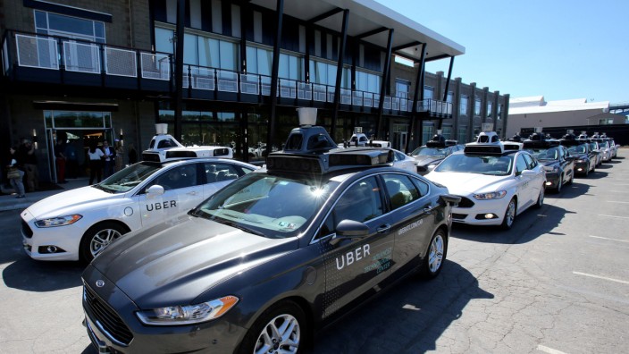 FILE PHOTO: A fleet of Uber's Ford Fusion self driving cars are shown during a demonstration of self-driving automotive technology in Pittsburgh