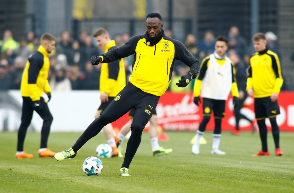 Usain Bolt participates in a training session with Borussia Dortmund
