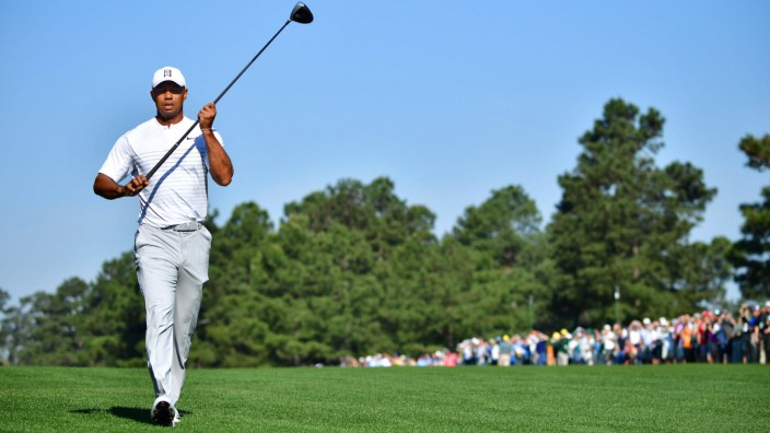 Tiger Woods walks on the 15th fairway during a practice round prior to the Masters golf tournament a