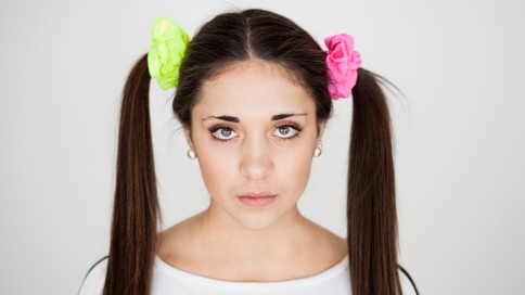 Teen with two ponytails and colourful scrunchies