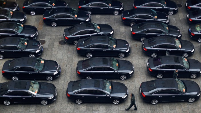 Cars are parked at the Great Hall of the People during the opening session of the 19th National Congress of the Communist Party of China in Beijing