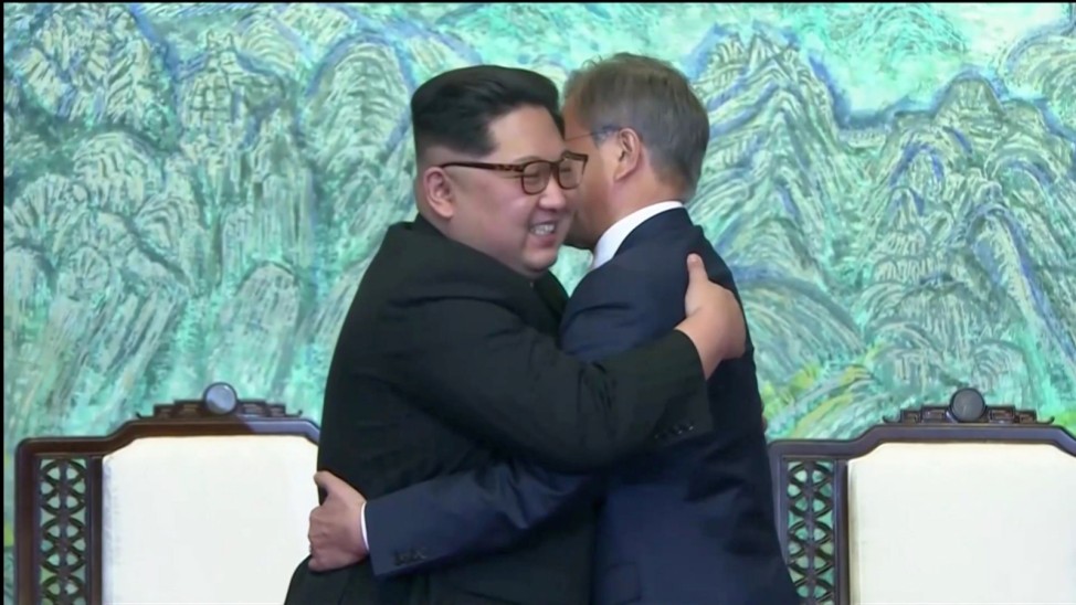 South Korean President Moon Jae-in and North Korean leader Kim Jong Un embrace after signing agreements during the inter-Korean summit at the truce village of Panmunjom