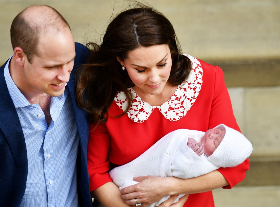 FILE PHOTO: Britain's Prince William and Catherine, The Duchess of Cambridge leaves the Lindo Wing at St Mary's Hospital with their newborn son in London