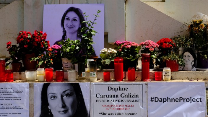 Posters referring to the Daphne Project are seen on the makeshift memorial to assassinated anti-corruption journalist Daphne Caruana Galizia on the Great Siege Monument in Valletta