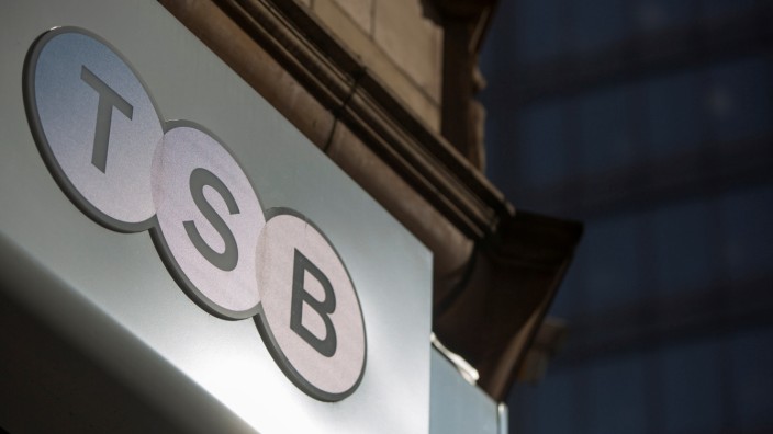 FILE PHOTO: A sign is displayed outside a branch of the TSB bank in central London