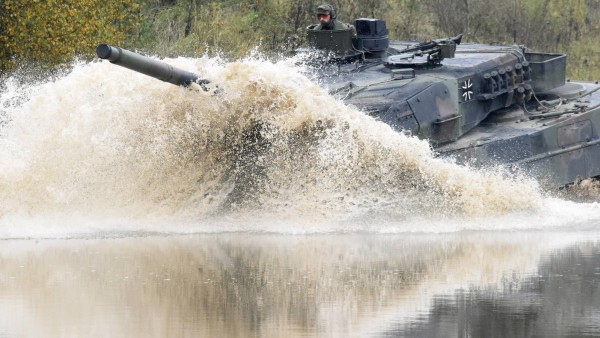 A Leopard 2 tank crosses a river during a German army, the Bundeswehr, training and information day in Munster