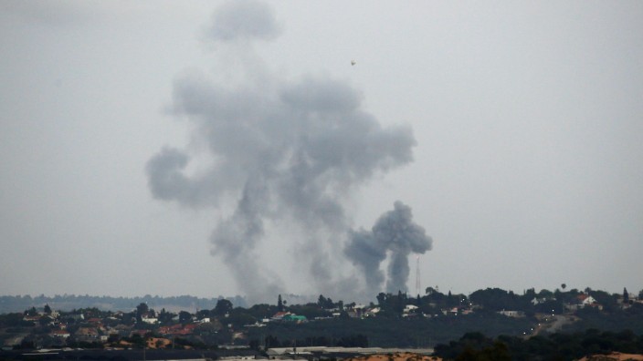 Smoke rises following an Israeli air strike on the Gaza Strip as seen from the Israeli side of the border