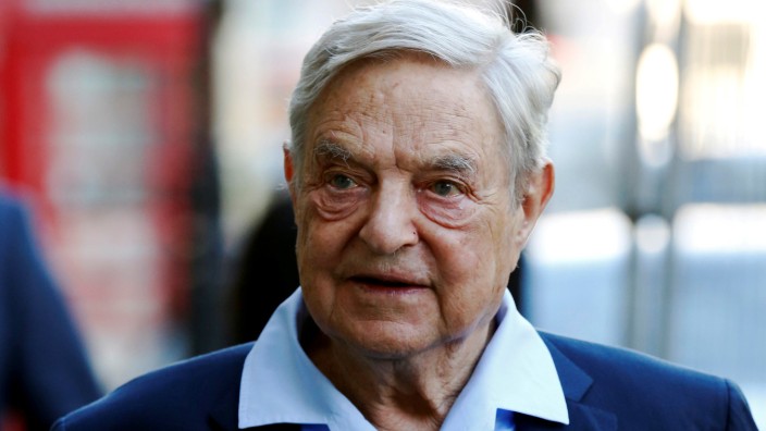 FILE PHOTO: Business magnate George Soros arrives to speak at the Open Russia Club in London