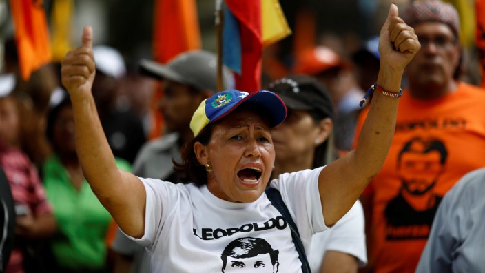 A woman shouts during a protest against upcoming presidential elections, in Caracas