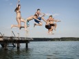 Five teenagers jumping from a jetty into lake mit_2003_00996