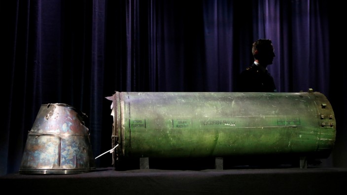 A damaged missile is displayed during a news conference by members of the Joint Investigation Team in Bunnik