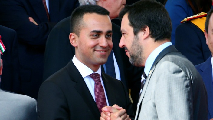 Italy's Minister of Labor and Industry Luigi Di Maio shakes hands with Interior Minister Matteo Salvini at the Republic Day military parade in Rome
